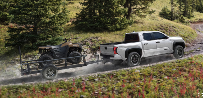 white toyota tacoma pulling small trailer